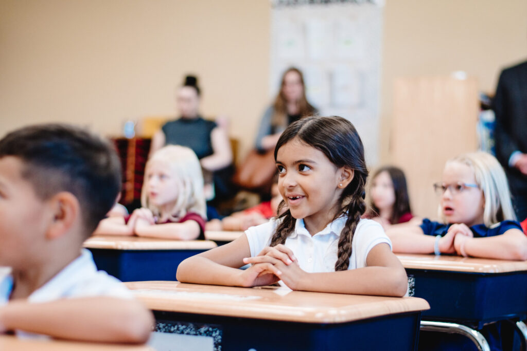 A Kindergarten student at Legacy Traditional Schools sitting at a desk