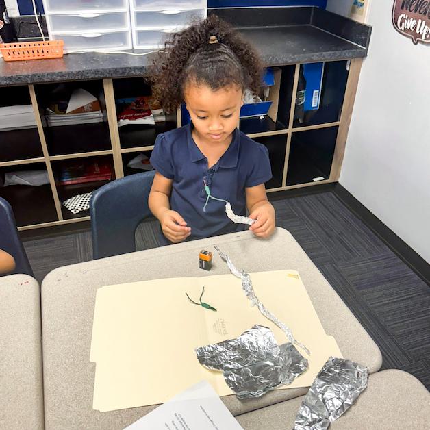 A student explores electricity through craft projects at Legacy Traditional Schools