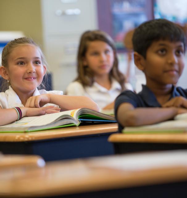 Students attentively at their desks during a tour of Legacy Traditional Schools